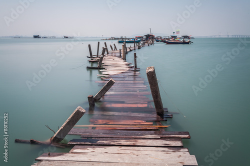 Water overflow on a broken wooden bridge