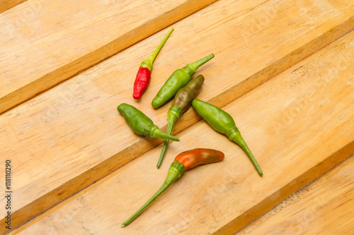 Obraz na plátně Hot chilli on wooden background
