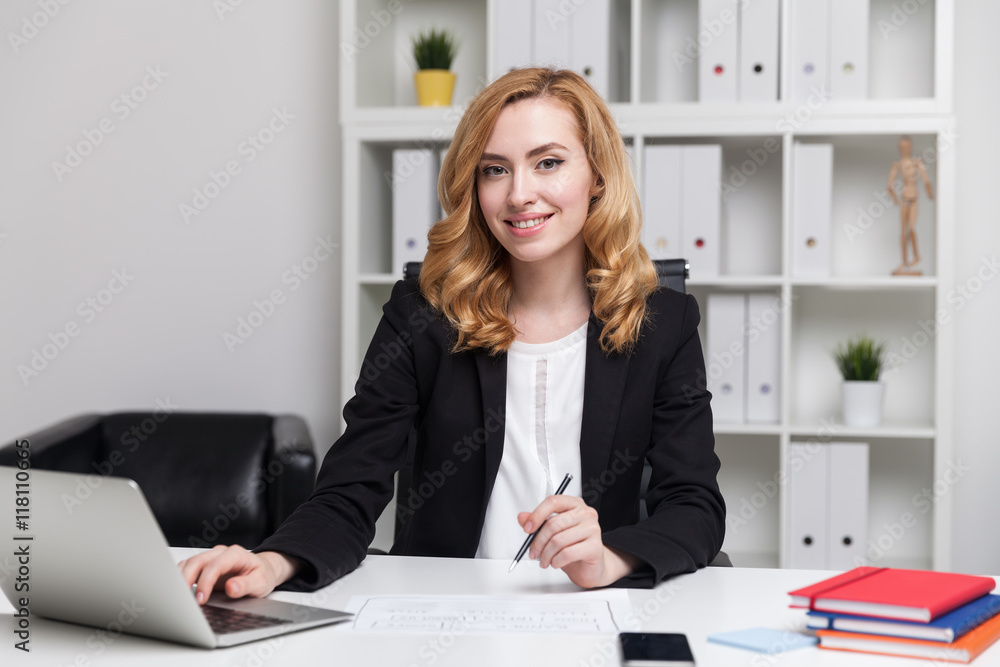 Business lady smiling and typing Business lady smiling and typing