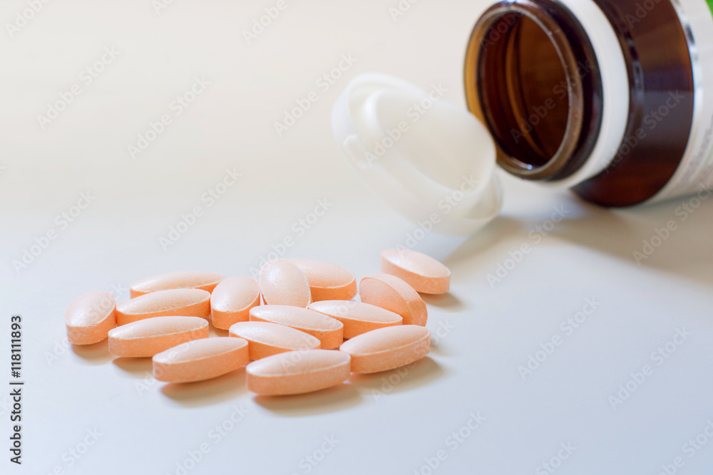 orange pills on warm white backgroun orange pills on warm white backgroun