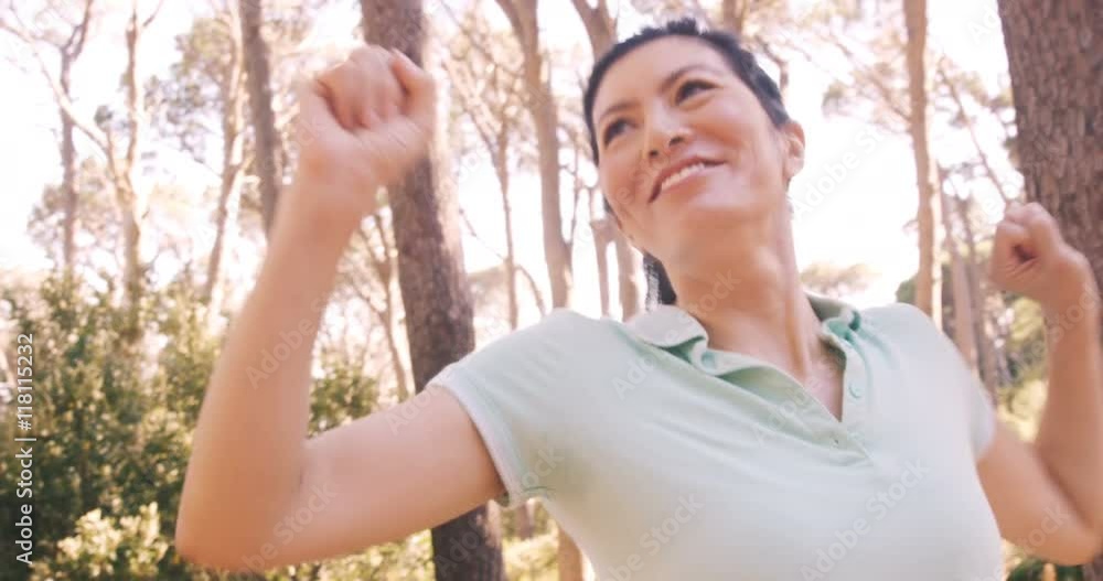 Couple setting up a tent at campsite