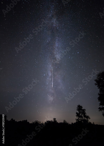 Shooting star and Milk Way. Perseid meteor shower night sky.