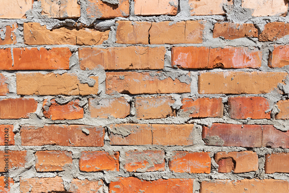 Fototapeta premium Old wall made of bricks with cement.