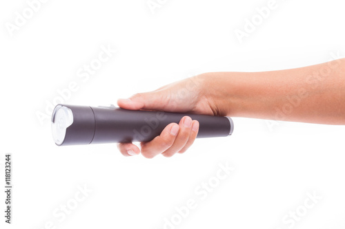 Hand holding flashlight on white background 