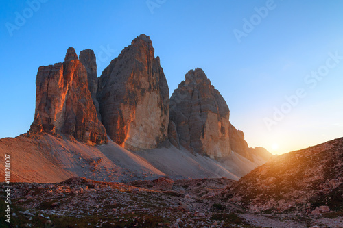 Tre Cime di Lavaredo in beautiful surroundings at sunset in the