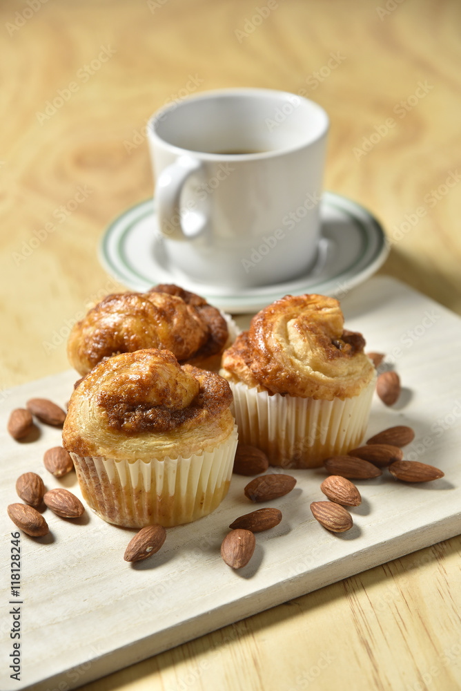 Almond danish cupcakes on wooden table. Almond danish cupcakes on wooden table.