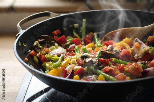 steaming mixed vegetables in the wok, asian style cooking 