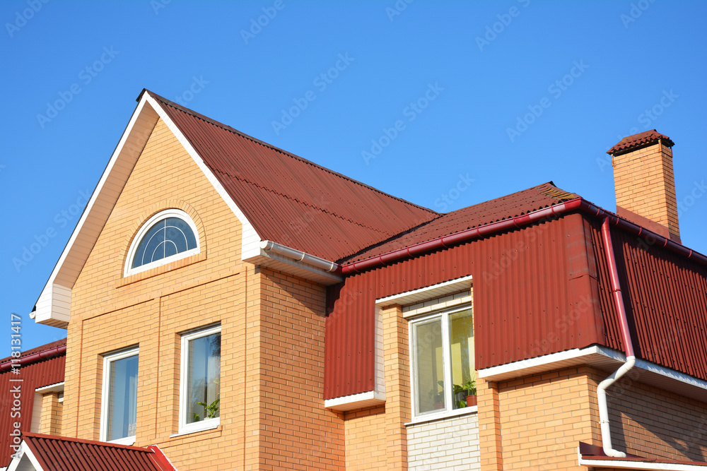  Attic roof exterior with asphalt shingles and plastic rain gutter
