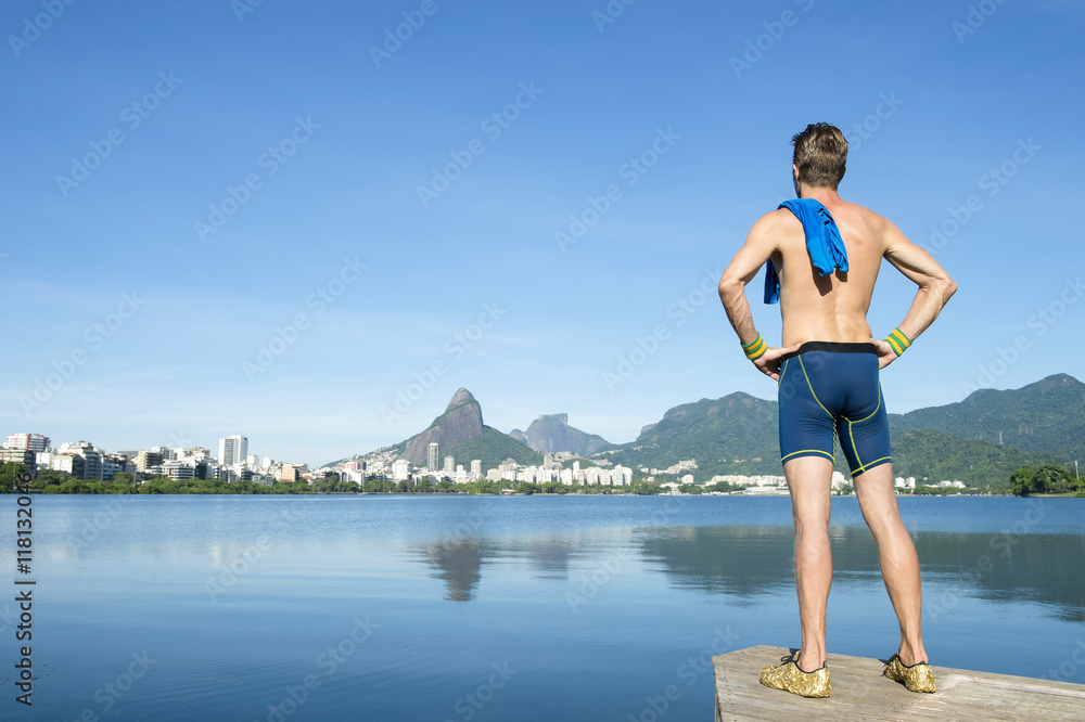 Athlete standing in front of the Rio de Janeiro skyline at Lagoa Rodrigo de Freitas lagoon