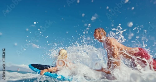 Father and son having fun surfing together, summer lifestyle family time