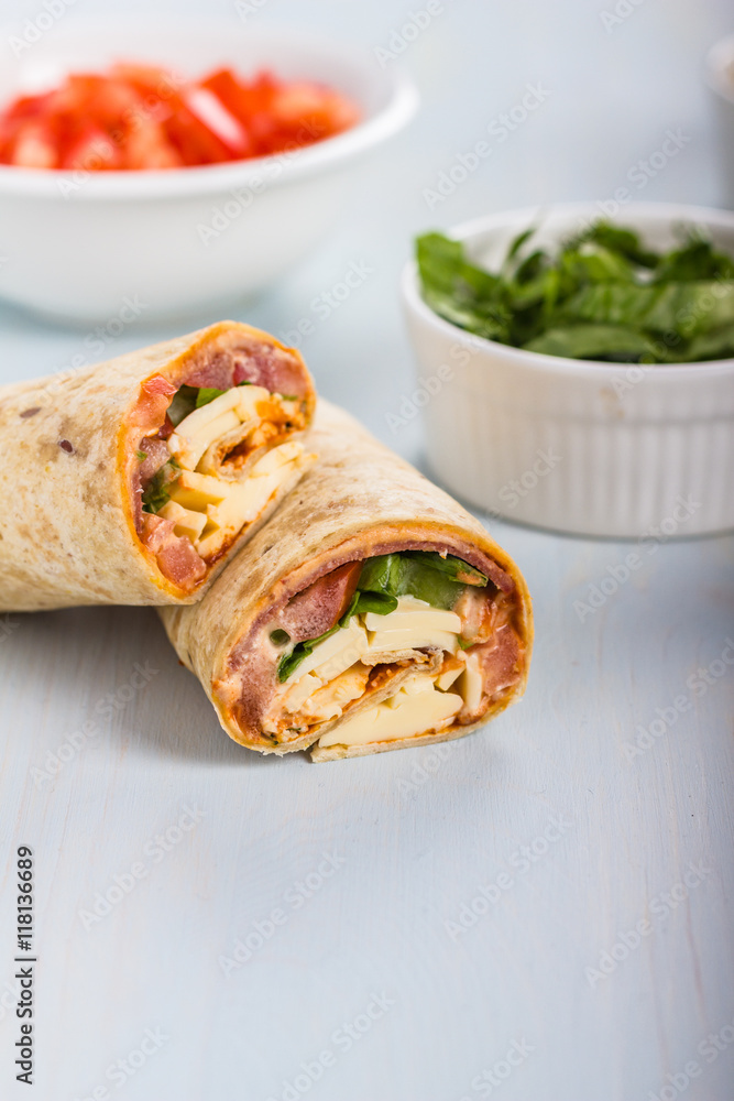 Wrap with tomato, lettuce, harissa and hoummous. Wrap with tomato, lettuce, harissa and hoummous.