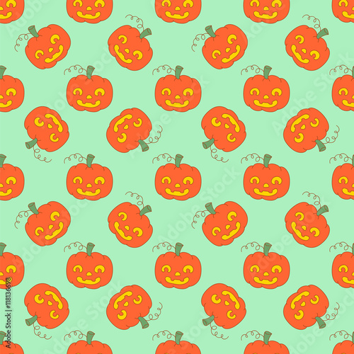 Evil faces of pumpkin pattern on a green background for Halloween.