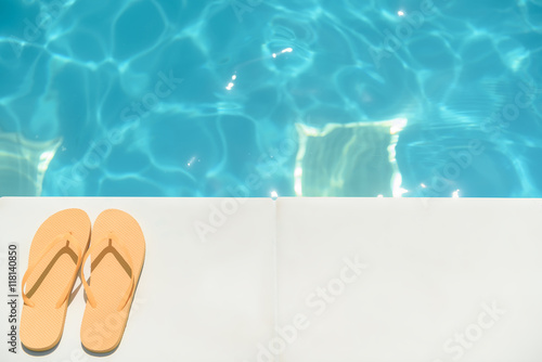 Flip flop shoes near blue water