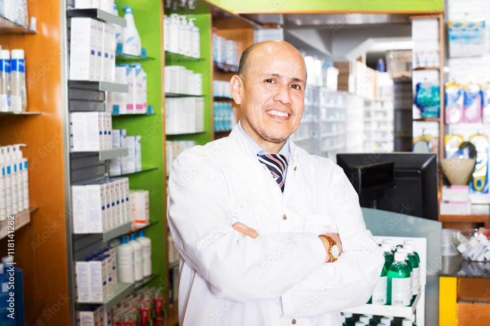 Male pharmacist working in farmacy