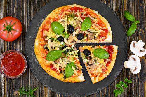 Pizza with Mushroom, Cheese, Mozzarella, Olives and Basil 