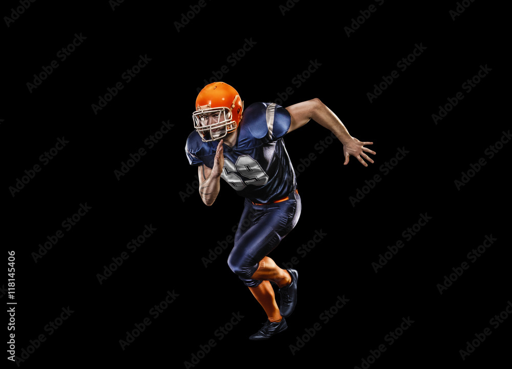 Professional american football player in action isolated on the black