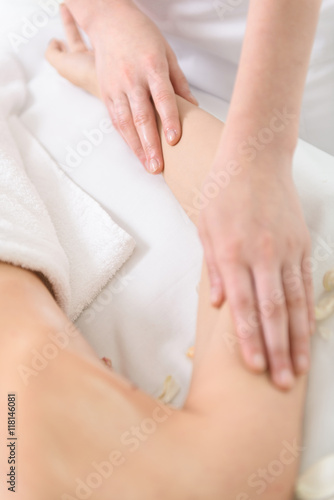 Professional beautician making massage of human hand