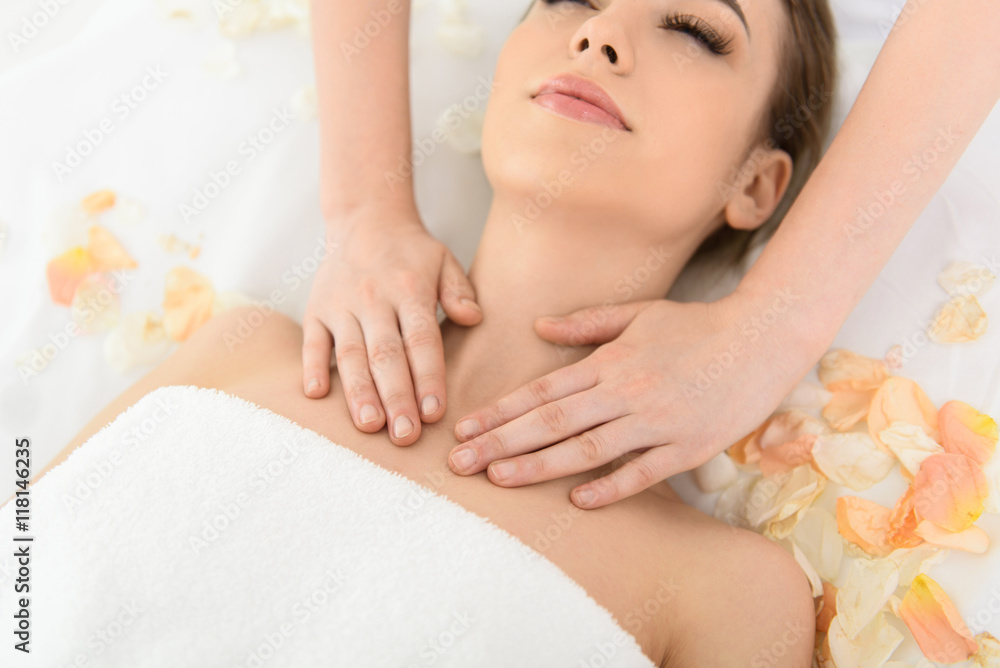 Pretty girl getting body massage Stock Photo | Adobe Stock