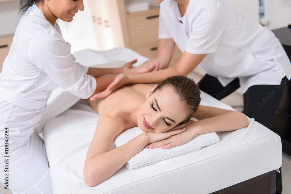 Pretty girl enjoying massage at beauty salon Pretty girl enjoying massage at beauty salon