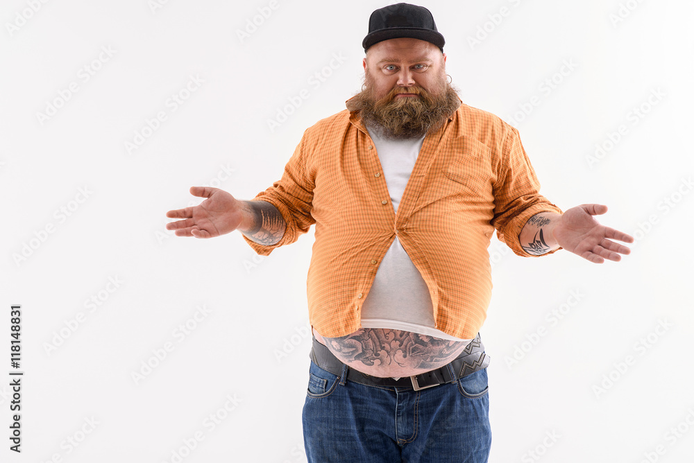 Man wearing a shirt that is too small for him Stock Photo