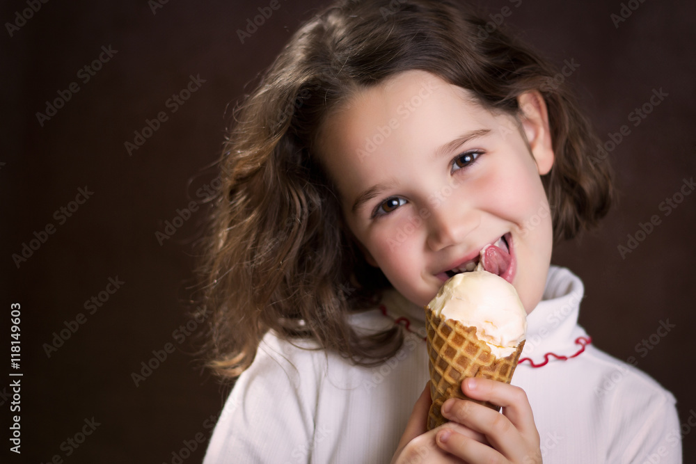 Girl holding and licking ice cream cone Girl holding and licking ice cream cone