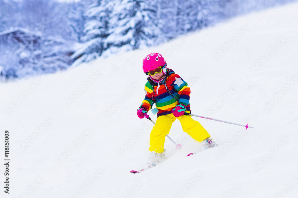 Little girl skiing in the mountains