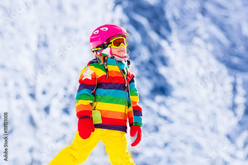 Little girl skiing in the mountains