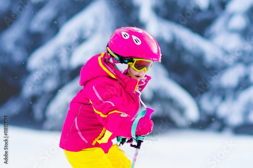 Little girl skiing in the mountains