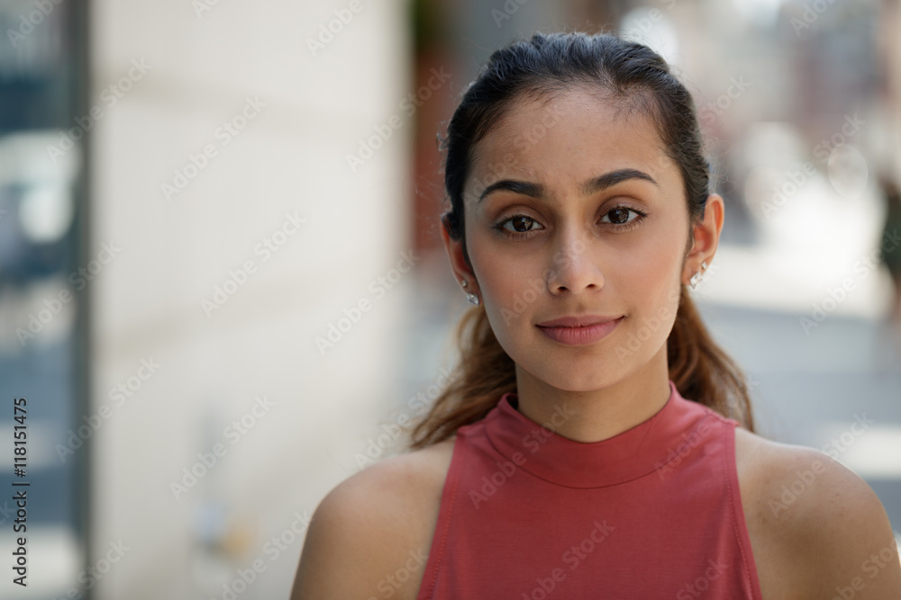 Young woman in city serious face Young woman in city serious face