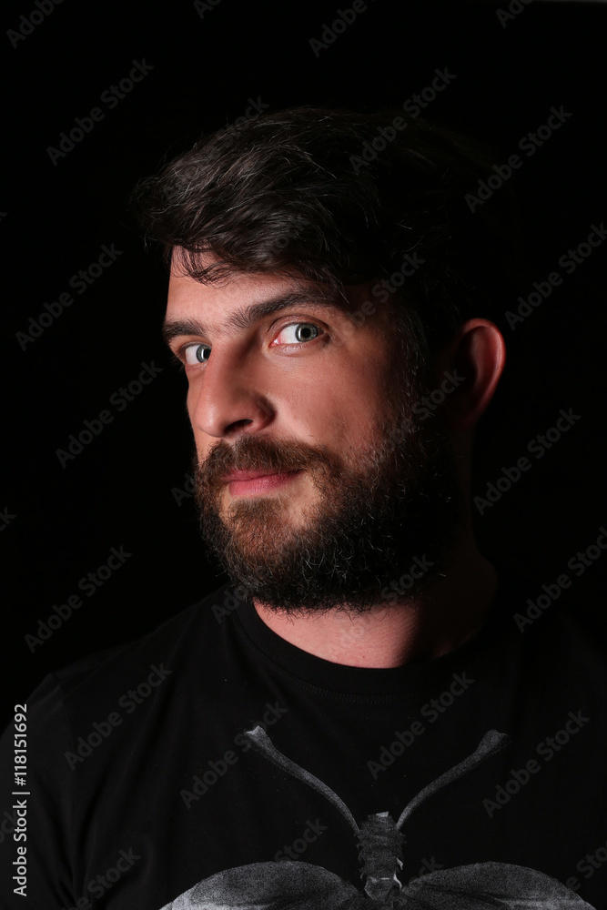 Fototapeta premium Bearded man wearing shirt with interesting look. Close.up. Black