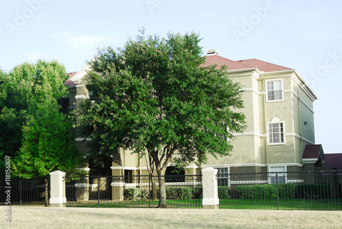 residential community and apartment building with green trees landscaping