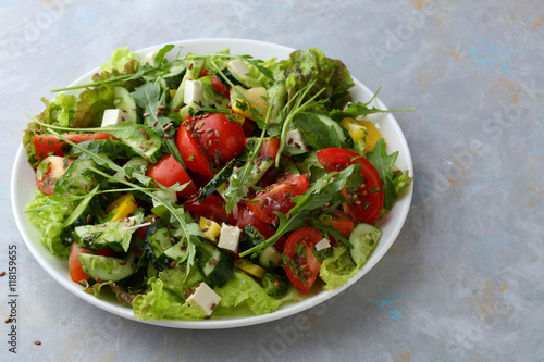 Healthy salad with arugula on plate