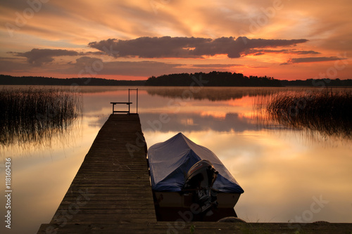 Lake at Sunrise, Small Boat tied to Wooden Pier © AVTG