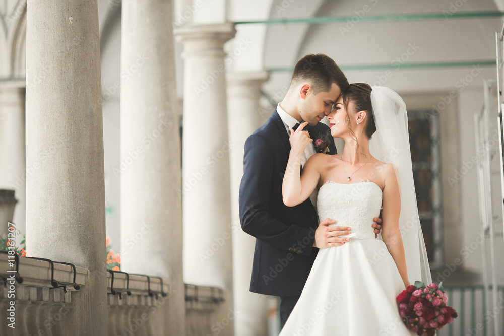 Luxury married wedding couple, bride and groom posing in old city Luxury married wedding couple, bride and groom posing in old city