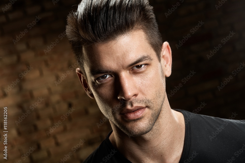 Obraz premium Portrait of handsome young caucasian man
