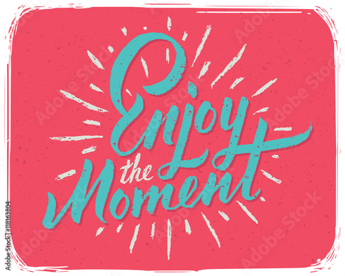 Motivational positive print for t-shirt with lettering calligraphic text composition "Enjoy the moment"