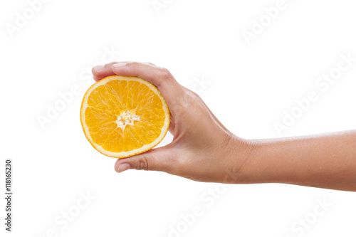 A female hand holding an orange slice, over white background with using path