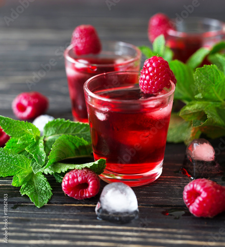 Fresh cocktail with raspberry, mint and ice