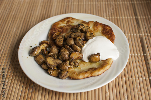 potato pancakes with mushrooms and sour cream