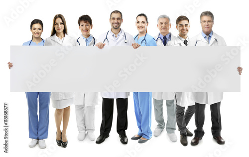 Smiling doctors with white ...