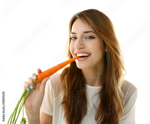 Beautiful girl eating carro...