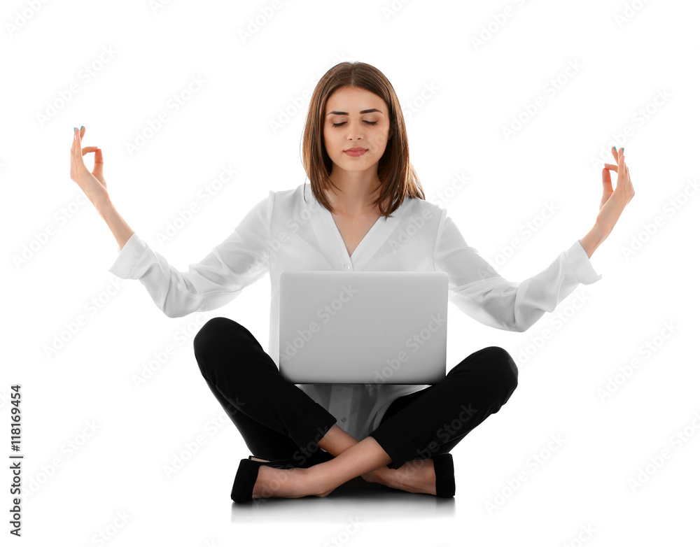 Businesswoman with laptop relaxing in meditation pose, isolated on white Businesswoman with laptop relaxing in meditation pose, isolated on white