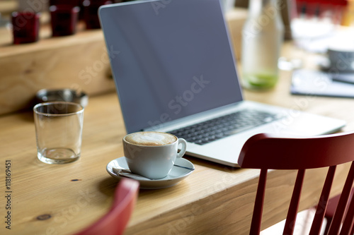 laptop with fresh cup of coffee