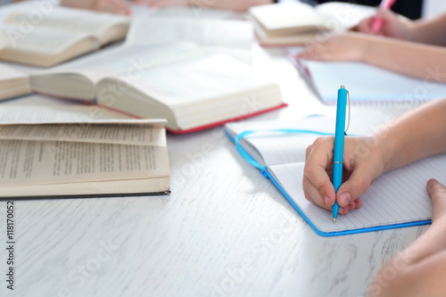 Slika na platnu Children doing homework, closeup