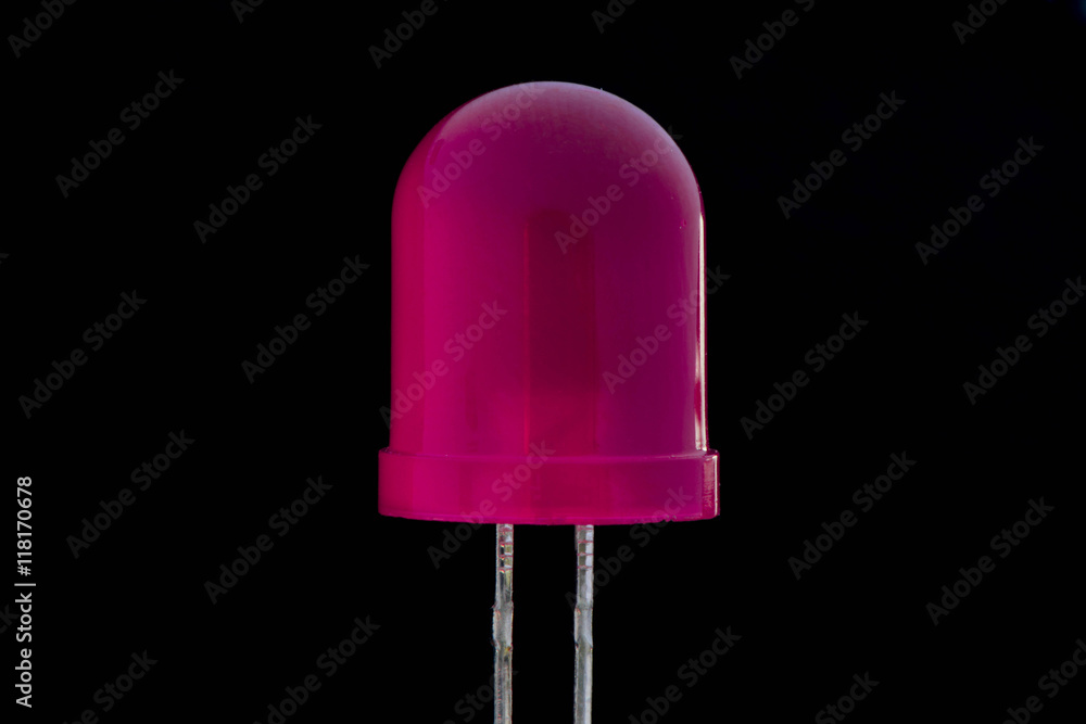 Macro of mini pink Acrylic LED bulb with black background - Low key Macro of mini pink Acrylic LED bulb with black background - Low key