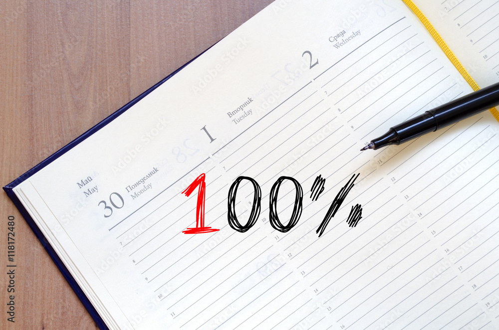 One hundred percent symbol on notebook One hundred percent symbol on notebook