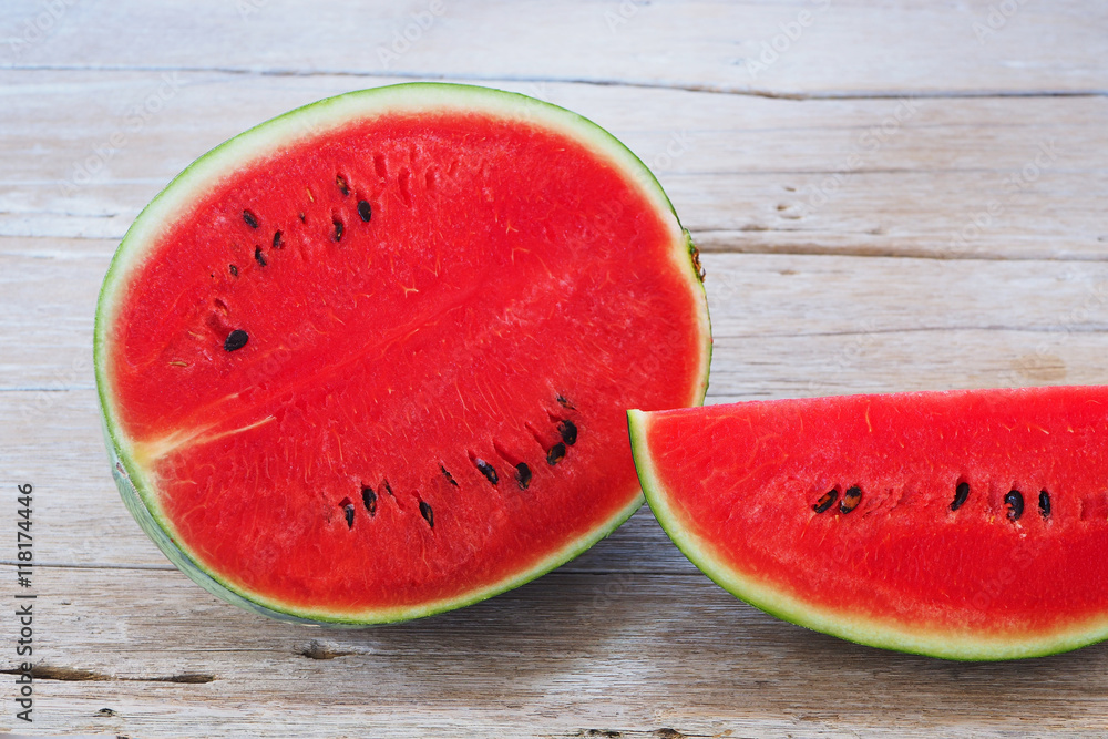 Close up of sliced watermelon on a wooden table. Close up of sliced watermelon on a wooden table.