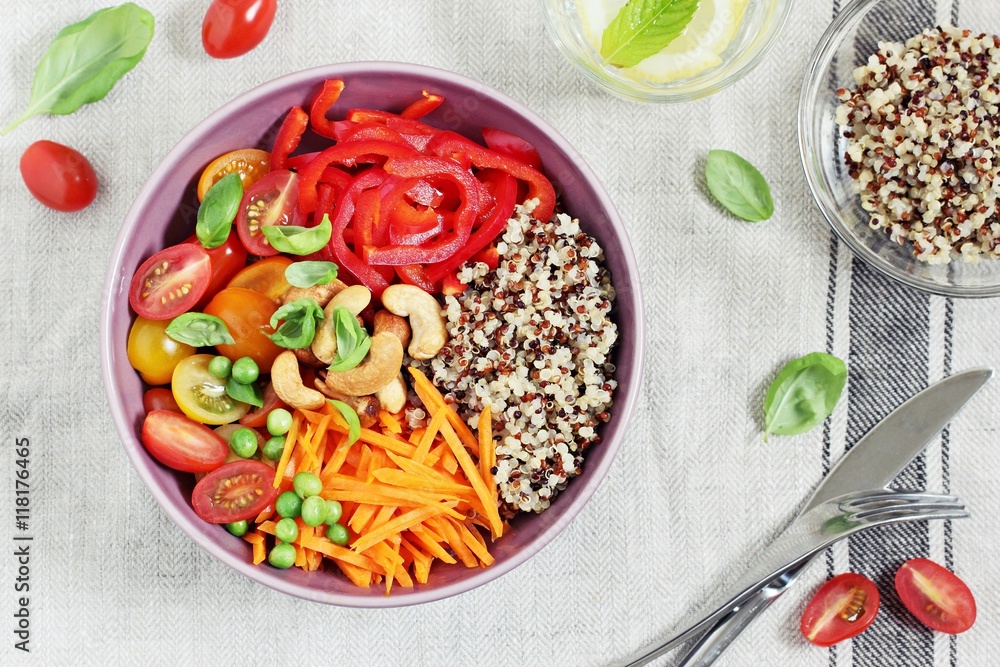 Quinoa bowl with raw vegetables and nuts. Superfoods and clean eating concept. Selective focus Quinoa bowl with raw vegetables and nuts. Superfoods and clean eating concept. Selective focus