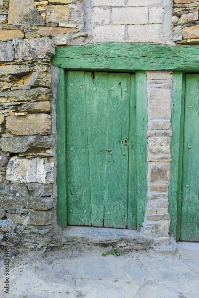Green door, wood and stone houses in the province of Zamora in S