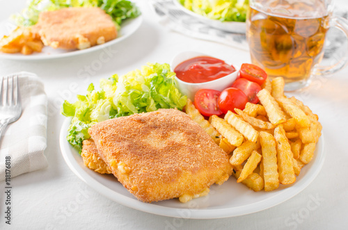 Fried cheese with french fries and lettuce